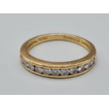 An 18K Yellow Gold Diamond 1/2 Eternity Ring. Size M 3.2g - 0.25ct.