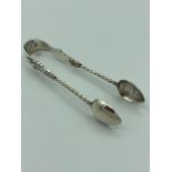 Antique pair of EDWARDIAN SILVER sugar nips,Having barley twist sides with biblical figures .