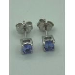 Pair of SILVER and TANZANITE stud earrings,Complete with certificate of authenticity and soft pouch.