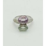 An 18K White Gold Diamond, Amethyst and Topaz Ring. 0.2ct diamonds. 6.2g total weight. Size N.