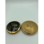 Two vintage compacts 1950/60?s, first is a STRATTON in gold tone,second is Black enamel and gold