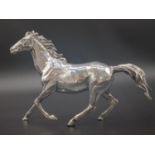 A sterling silver galloping horse. Length: 19.5 cm, height: 14 cm, weight: 347.5 g.