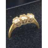 18 carat GOLD TRILOGY DIAMOND RING having three diamonds set to top, full UK hallmark.Total 0.33