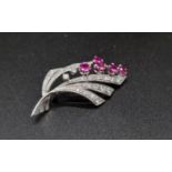 A Vintage 18K White Gold Natural Burmese and Diamond Brooch. Over 1ct diamonds. Over 1.ct rubies.