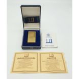 A 1960s Dunhill Gold Plated Lighter. Comes in original box with certificate. Very good condition.