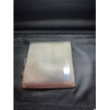 Hallmarked art deco SILVER cigarette case. Engine turned design with blank cartouche. 88 grams. af.