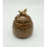 A honey bee hive pot by Devonware, stands 12cm