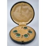 Five Victorian, sterling silver buttons with enamel and gilded details in original presentation box.