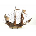 A technical made wooden model of the HM Golden Hind on original stand. Dimensions 82cm x 62cm.