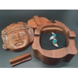 A puzzle, hand carved, wooden, trinket box in the shape of a Deity seen at Angkor Wat, Cambodia.