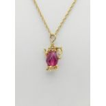 A Vintage 9K Yellow Gold Prince of Wales-Link Necklace with a 9K Yellow Gold Pink Ruby Tea Pot