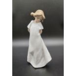 A Nao by Lladro Porcelain Figure. Shy Little Daisy. 20cm tall.