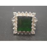 A vintage 18K White Gold Tourmaline and Diamond Ring. Square tourmaline centre stone surrounded by a