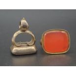 An Early Victorian Yellow Metal Pair of Seals - Carved Carnelian and Agate. 2 x 2.5cm.