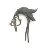 AN ANTIQUE BRONZE JAPANESE MEIJI CRANE HOLDING A LOTUS BUD IN ITS MOUTH (MISSING ITS BASE AND