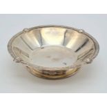 A SOLID SILVER HALLMARKED DISH. 132gms 13cms diameter a/f