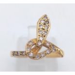 An 18 K yellow gold ring. Snake shaped with diamonds. ring size: j1/2. weight: 2.5 g.