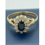 9 carat gold SAPPHIRE RING having centre mounted oval sapphire with clear stone surround. 2.42