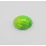 A 4.18ct Natural Green Fire Opal Gemstone in Oval Cabochon. Come with IGL&I Certificate