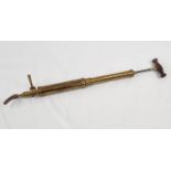 A Vintage - Possibly Antique Brass Air Pump. Wood handle. In working order. As found