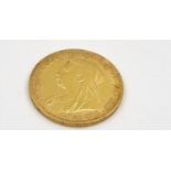 An 1896 22K Gold Full Sovereign Coin. This coin year has the last obverse widow-head Queen