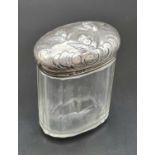 An Antique Silver-Topped Dressing Table Jar. Cherubic decoration. Hallmarks for 1902 London - The
