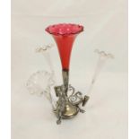 An Antique White Metal Four -Stemmed Vase. Largest Cranberry glass holder to centre. Dragon