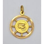 An 18K Yellow Gold Pendant of one of Natures Most Frightening Encounters - A Woman at the Wheel. 28g