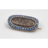 An Antique Victorian Mourning Brooch. Blue enamel beads and woven hair set on a gold backing. 2.5cm