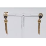A pair of vintage 18k yellow gold earrings featuring a sapphire top and tassels. Weight 4.8 grams