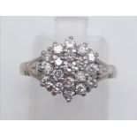 An 18 K white gold ring with a diamond cluster (0.5 carats), Ring size: L, weight: 3.5 g.