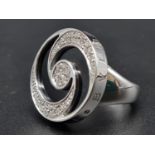 A BULGARI SPINNING FASHION RING IN STAINLESS STEEL WITH DIAMONDS AND ENAMEL TOP. 23.7gms size K/L