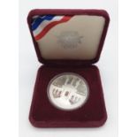1984 USA Olympic Dollar coin in original box.