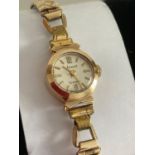 Vintage ACCURIST 9 CARAT GOLD ladies cocktail wristwatch with rolled gold expandable strap. Small