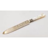 An Antique Small Silver Roll knife. Mother of Pearl handle. Hallmarks for Chester. 17cm length.