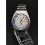 A Seiko 5 (circa 1985) Gents Wristwatch. Stainless steel strap and case - 35mm. White, blue and