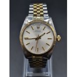 A ROLEX OYSTER PERPETUAL IN BI-METAL WITH SILVERTONE FACE. 31mm