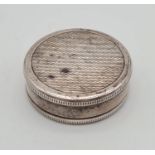 A Solid Silver Mappin and Webb Pill Box. London 1979 hallmarks. 3.5cm diameter. 14.8g