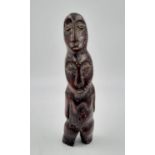 A 19th Century African ivory, double headed, female figure. Height: 16 cm, weight: 99 g.