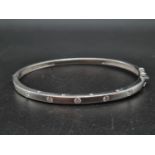 An 18K White Gold Diamond-Set Bangle. 17.2g. 0.4ct