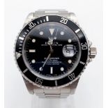 A ROLEX SUBMARINER IN STAINLESS STEEL WITH BLACK FACE AND BEZEL 40mm