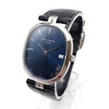 A RARE PATEK PHILIPPE STEEL WATCH WITH BLUE FACE ON ORIGINAL STRAP 28 X 33mm