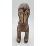 Antique 19th century African carved ivory fertility figurine with unusual looking face, this