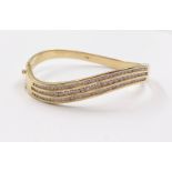 A Stunning 14K Yellow Gold Diamond Twist Bracelet. Over 100 bright-white diamonds. (2ct approx) 25.