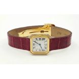 A CARTIER 18K GOLD LADIES TANK STYLE WATCH WITH CARTIER RED CROCODILE AND 18K GOLD STRAP. 25mm