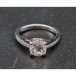 A Platinum Solitaire Diamond Ring with diamond shoulders. 3.82g. 1.02ct. Size I 1/2.