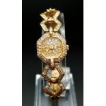 AN 18K GOLD AND DIAMOND ENCRUSTED LADIES DRESS WATCH BY JEANEAU WITH SOLID GOLD STRAP 16mm