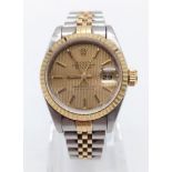 A LADIES ROLEX OYSTER PERPETUAL DATEJUST IN BI-METAL WITH GOLDTONE FACE. 26mm