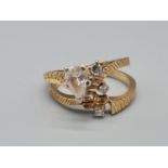 An 18K Yellow Gold Two-Piece Diamond Ring with a Marquise-Cut Diamond Solitaire -0.5ct. 6.2g total