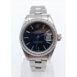 A ladies, stainless steel, ROLEX, Datejust, watch. 26 mm dial with black face. In excellent